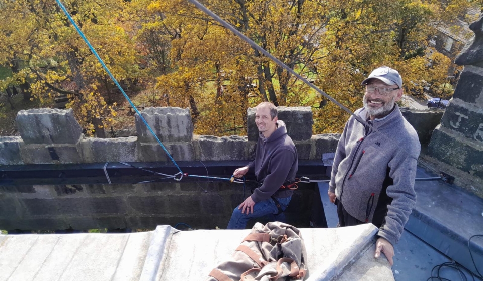 Putting up the star on the church roof